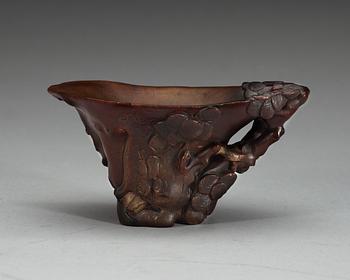 A carved rhinoceros libation cup, Qing dynasty, 18th Century.