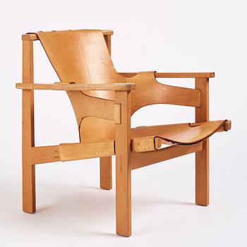 Carl-Axel Acking, a Swedish Modern oak and natural brown leather 'Trienna' chair, Nordiska Kompaniet.