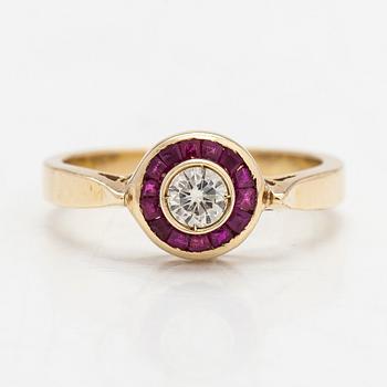 A 14K gold ring with a diamond ca. 0.23 ct and rubies.