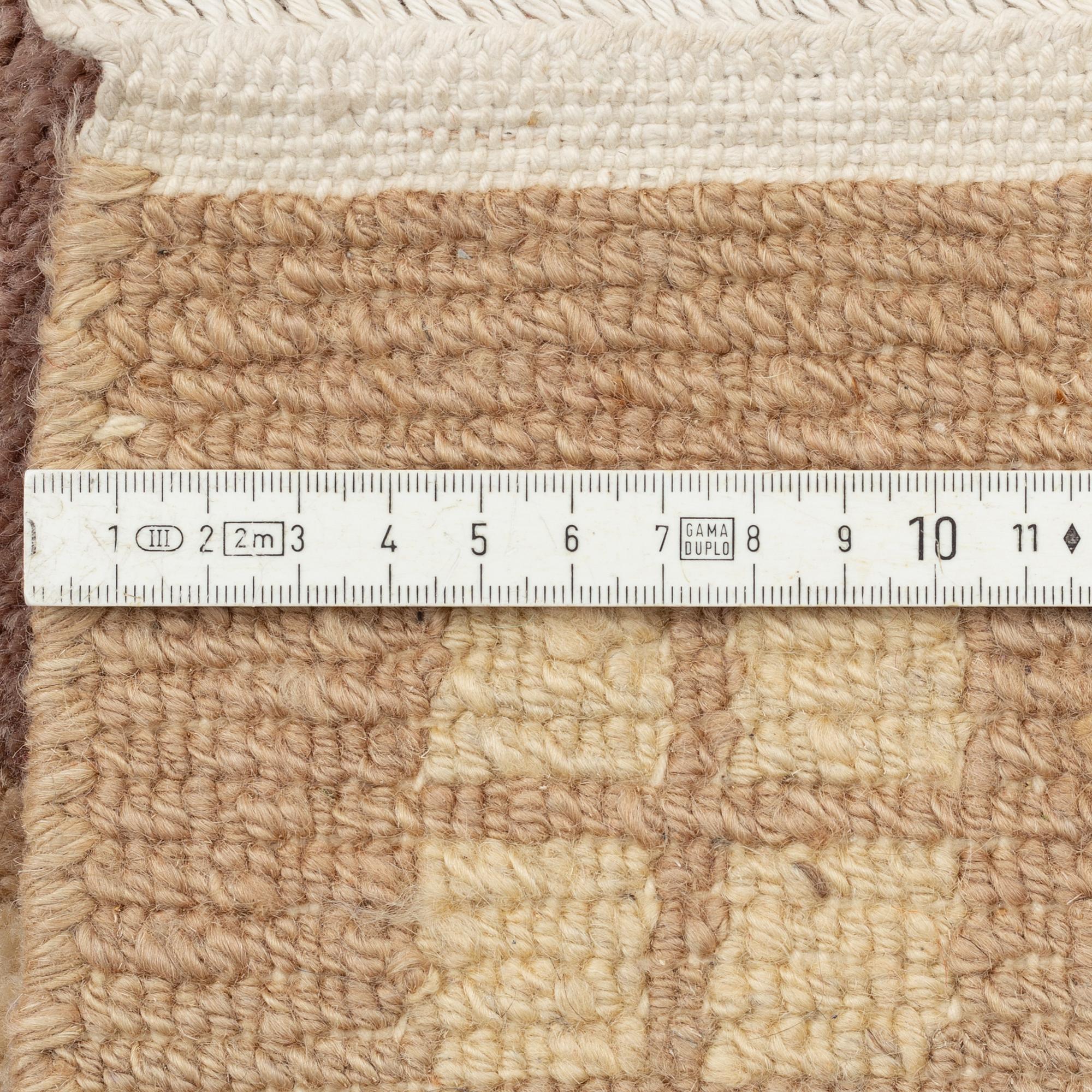 A carpet, Tibet, c. 245 x 357 cm.