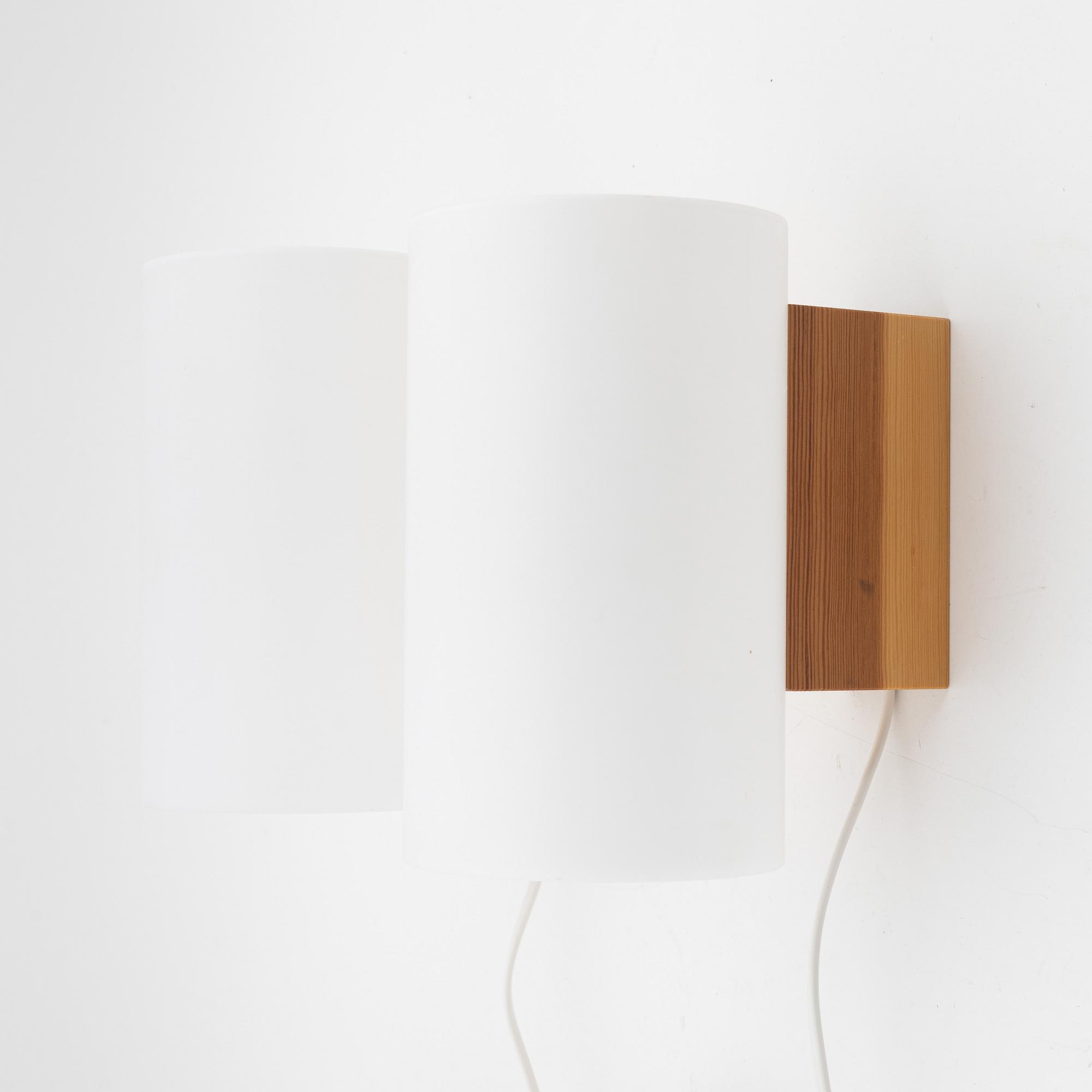 A pair of pine and acrylic wall lights, Luxus, Vittsjö.