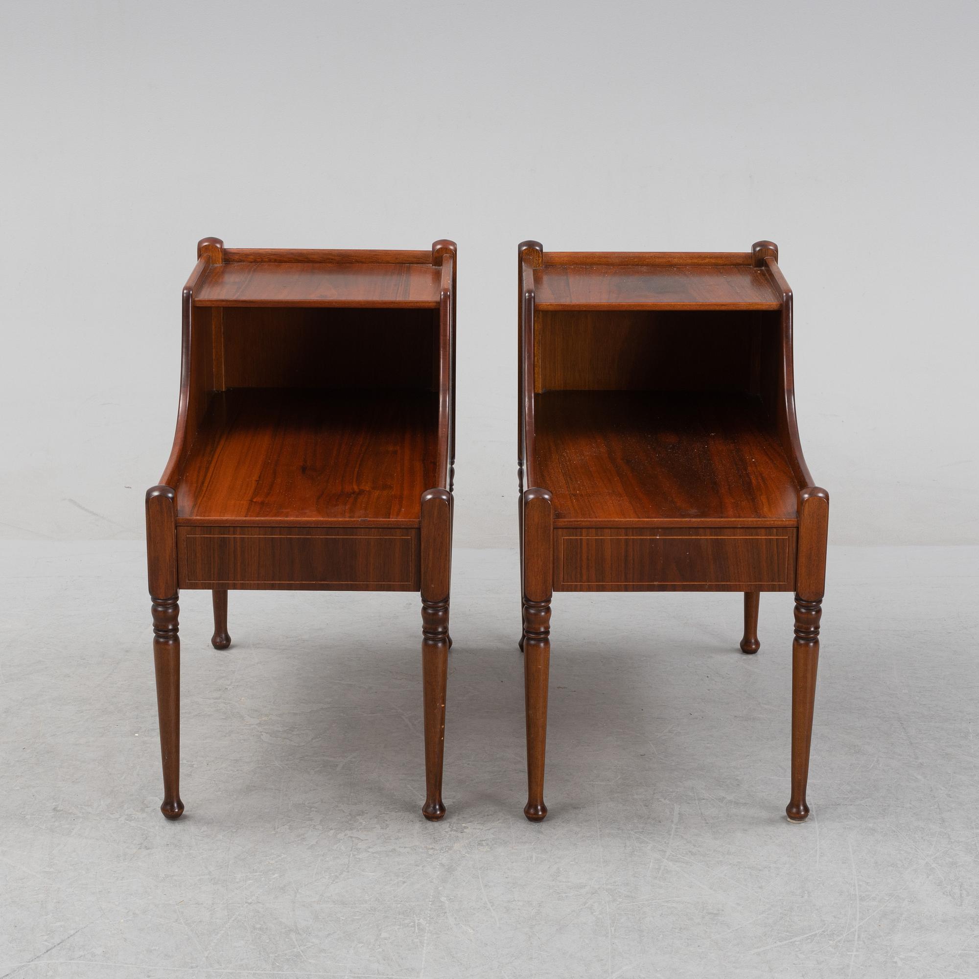 A pair of mahogany veneered bedside tables, later part of the 20th Century.