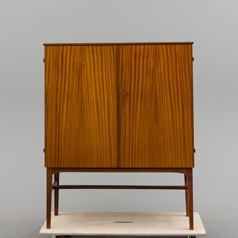 A 1950s mahogany veneered cabinet.