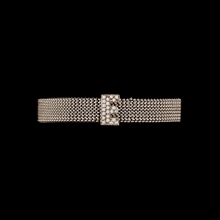 RANNEKORU, 18K valkokultaa, timantteja yht. n. 0,20 ct. Paino n. 30 g.