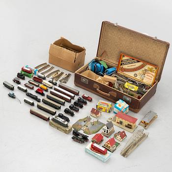 Märklin, among others, collection of locomotives, carriages, and accessories, 1950s-60s.