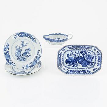 A blue and white porcelain charger, three plates and a sauce snipe, Qing dynasty, Qianlong (1736-95).
