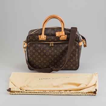 Louis Vuitton, a monogram canvas carry on bag.