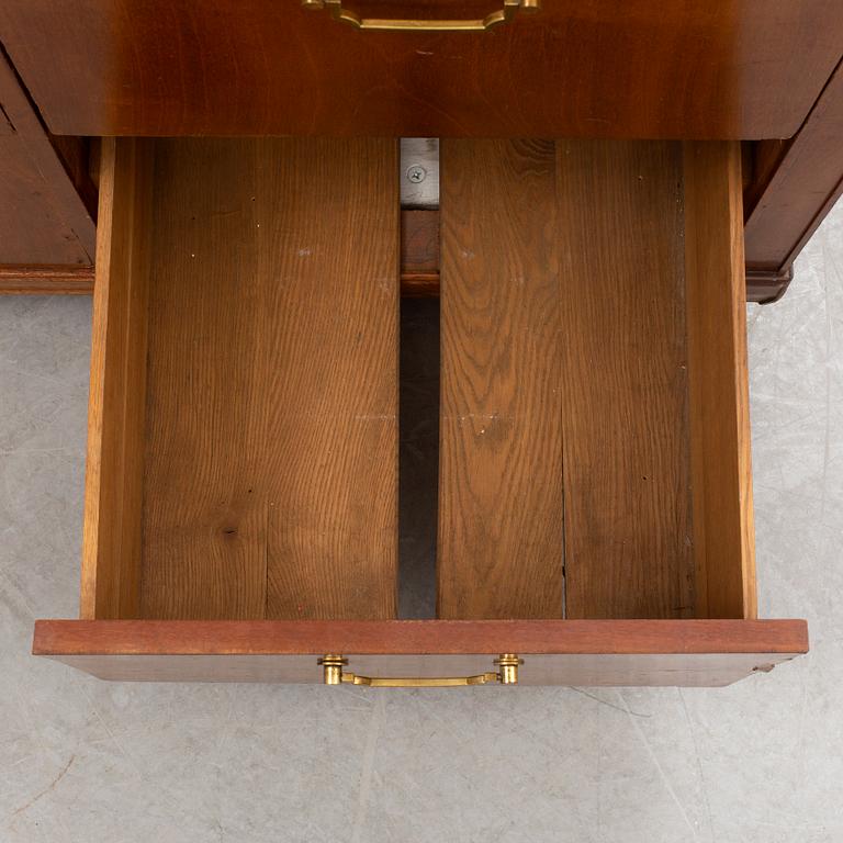 A mid 20th Century mahogany veneered  desk.