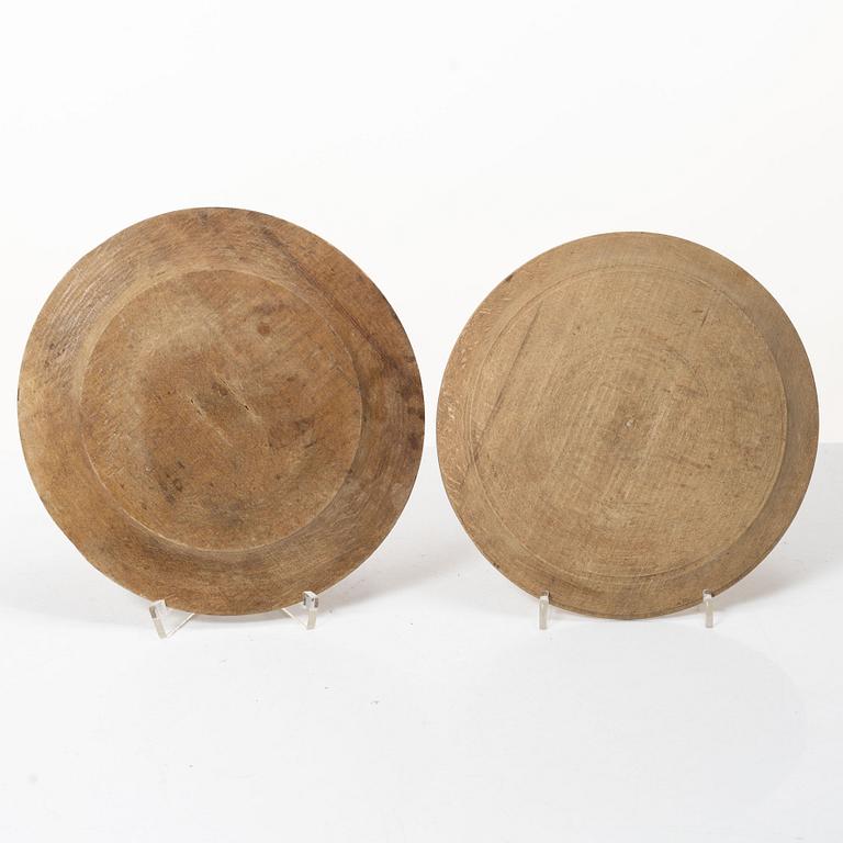 Twelve wooden plates, 19th Century.