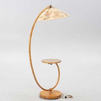 A 1930's/40's floor lamp with table.