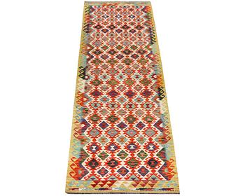 A Kilim runner carpet, c. 406 x 87 cm.