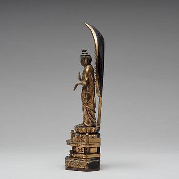 A Japanese gilt and lacquered wooden figure of Buddha and a travel shrine, Edo Period, 19th century.
