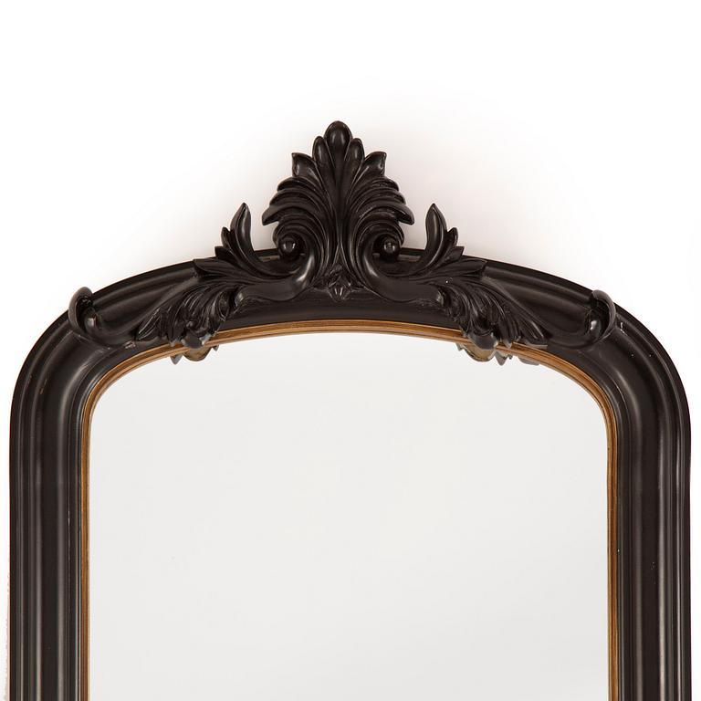 A contemporary floor mirror.