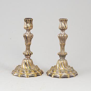 A pair of 18th century argent haché candlesticks.