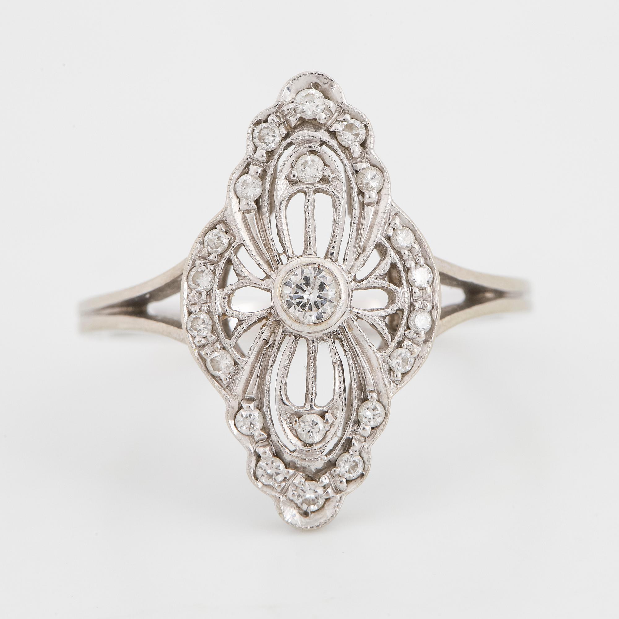 White gold and brilliant-cut diamond ring.