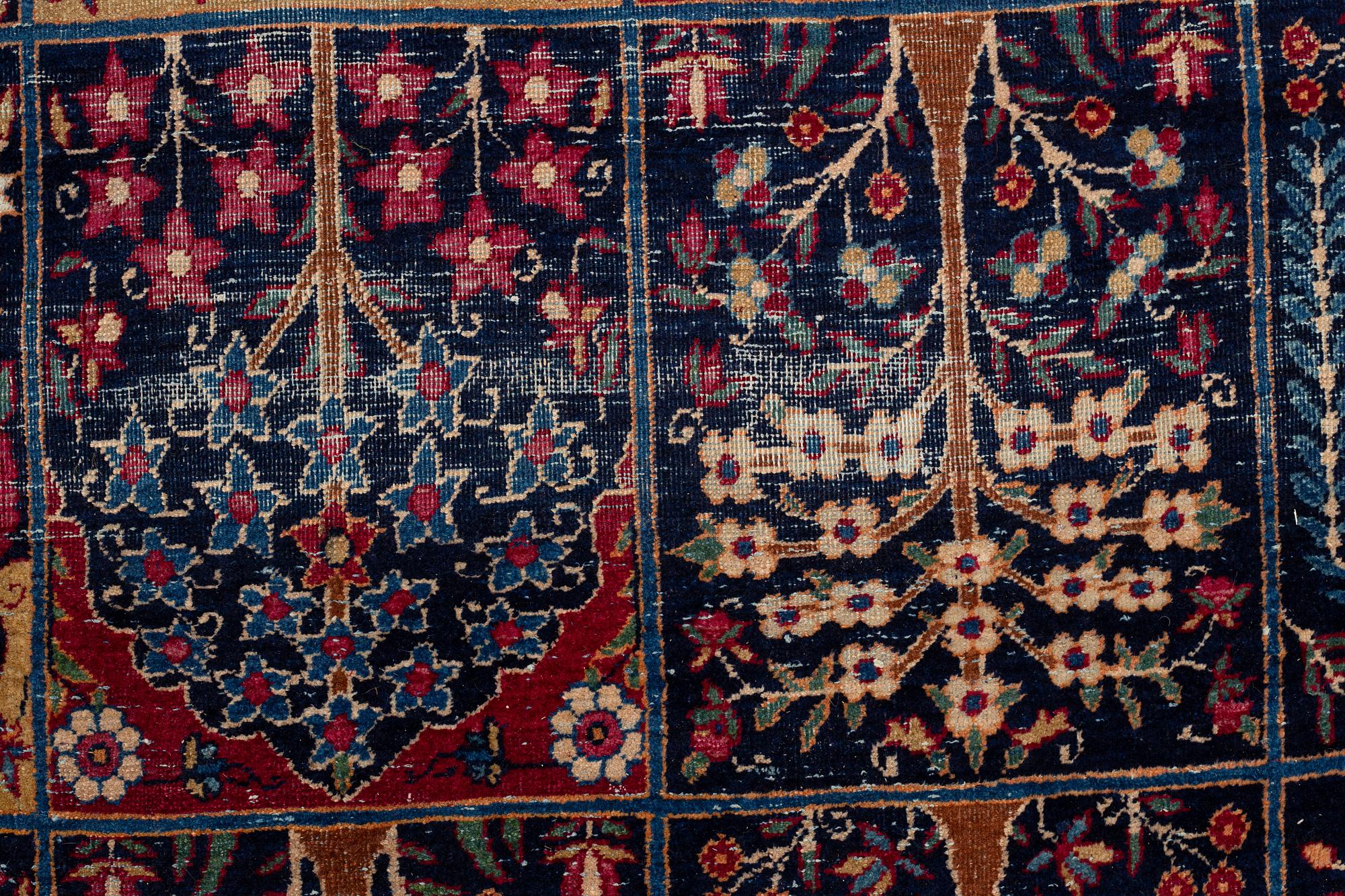 A carpet, an antique/a semi-antique Yezd, ca 557-562 x 366,5-370,5 cm.