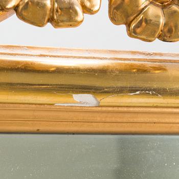 An Art Nouveau mirror with console table from early 20th century.