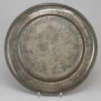 A pewter plate, dated 1787.