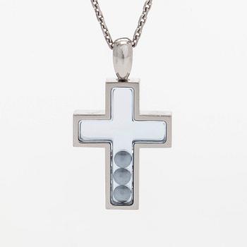 Chopard, an 18K whitegold 'Happy Diamonds" cross necklace set with diamonds.