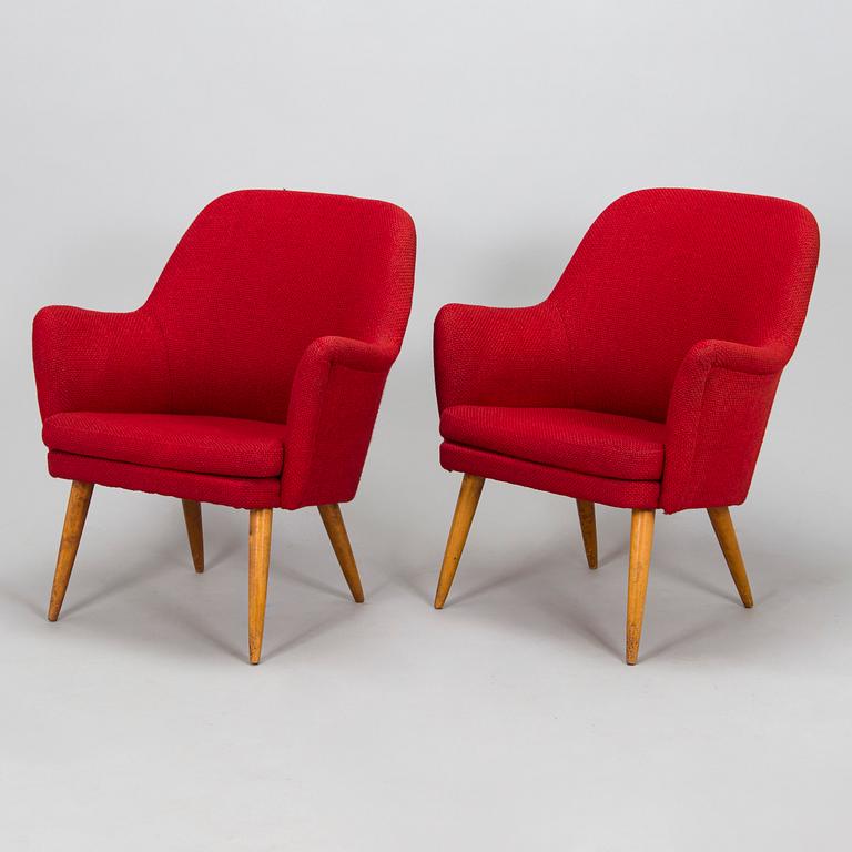 A pair of mid-20th century armchairs.