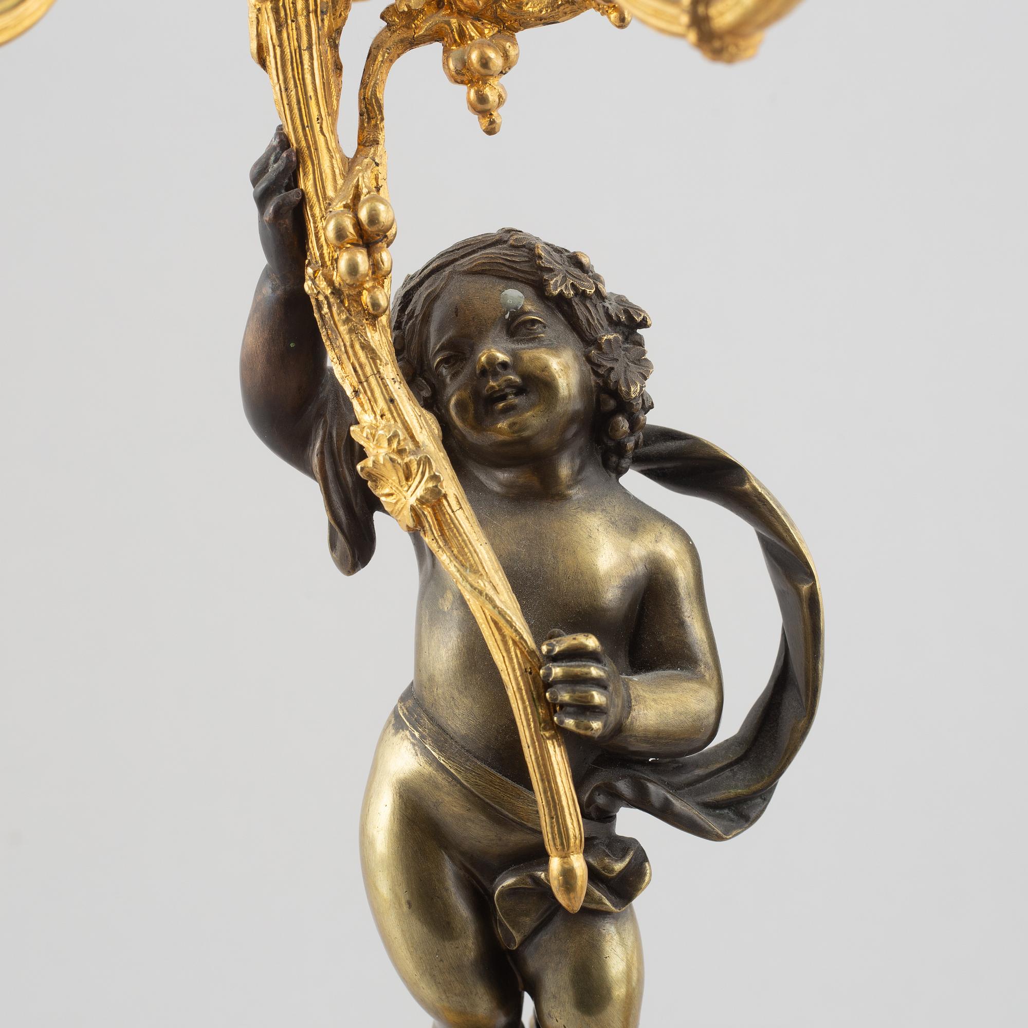 A pair of bronze and marble candelabra, possibly France, late 19th century.