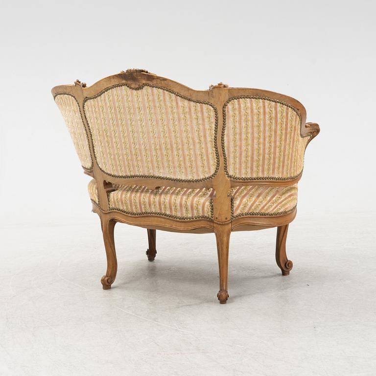 A Louis XV style marquise chair, around the year 1900.