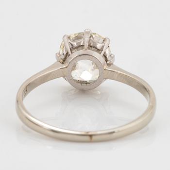 An 18K white gold ring set with a cushion formed old-cut diamond weight ca 2.75 cts quality ca L/M i.
