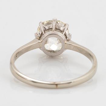 An 18K white gold ring set with a cushion formed old-cut diamond weight ca 2.75 cts quality ca L/M i.