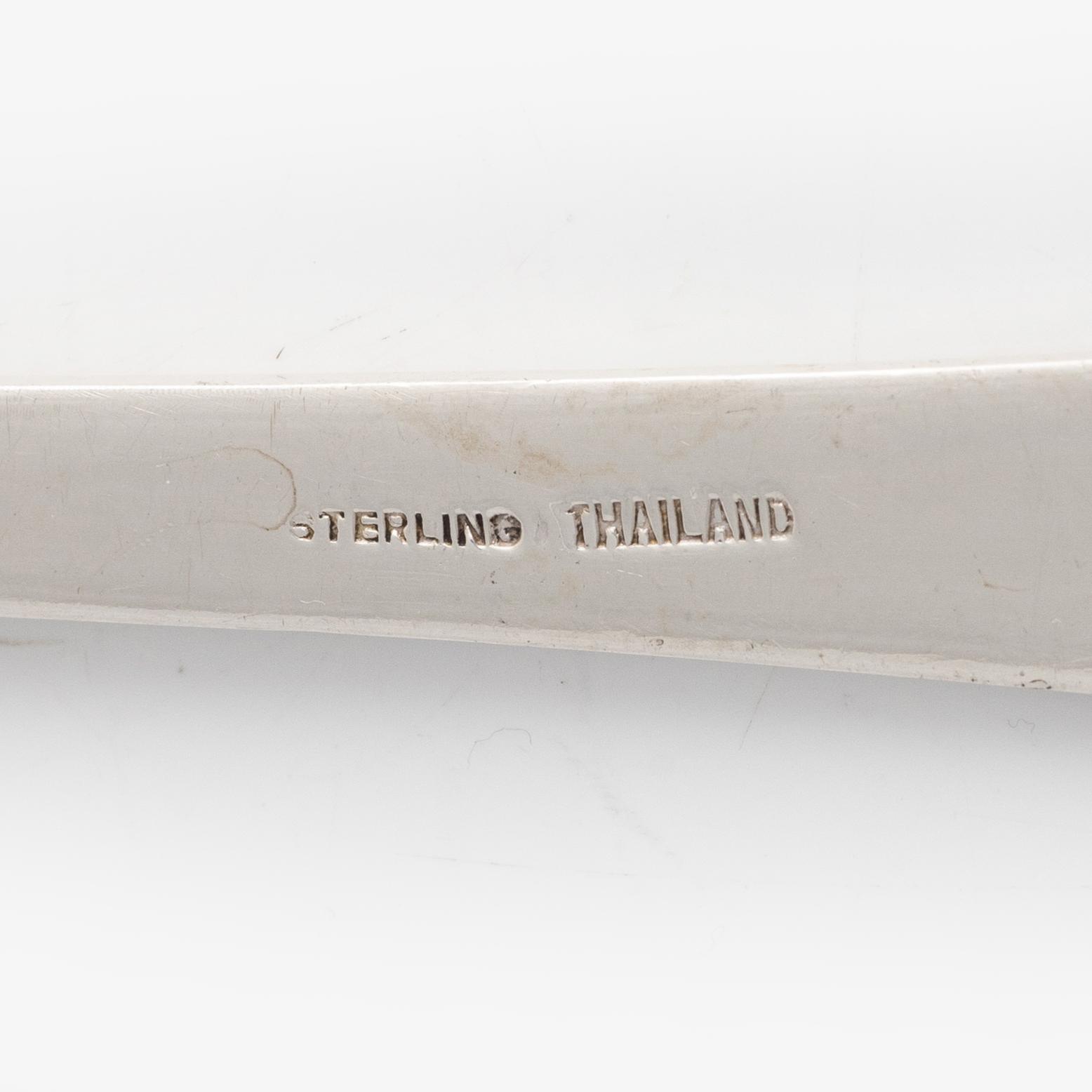 Four sterling silver servers, Thailand 20th century.