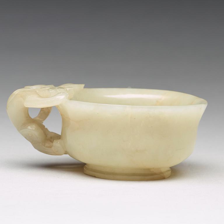 A carved nephrite Qilong goblet, Qing dynasty (1644-1912).