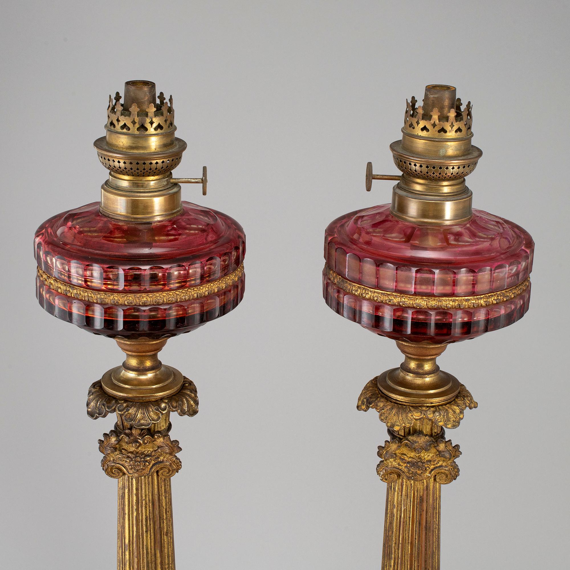A pair of empire style table oil lamps, bronzed metal and glass, Dublot Freres, Rennes, late 19th century.