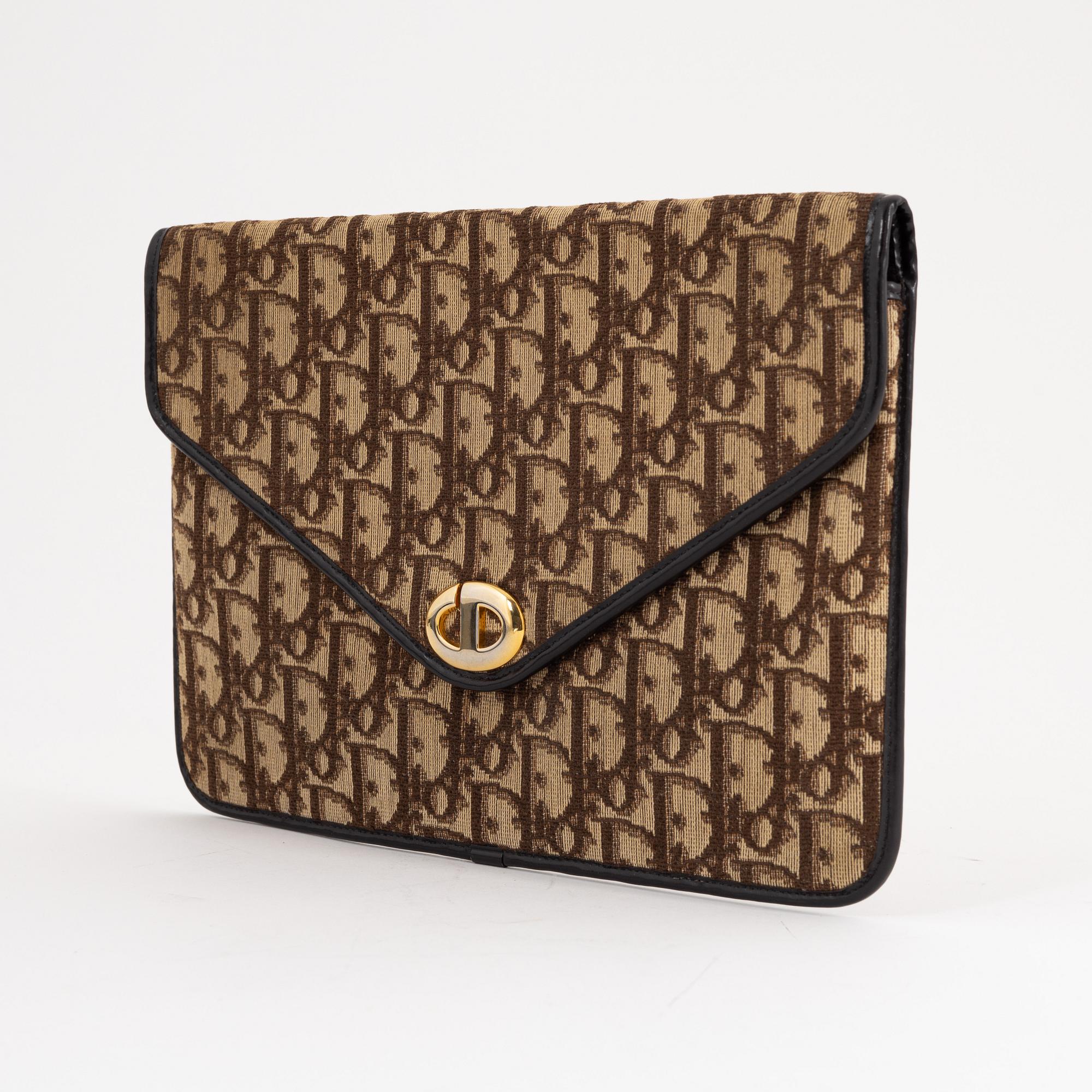 Christian Dior a canvas clutch. Bukowskis