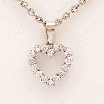 An 18K white gold pendant set with round brilliant cut diamonds.