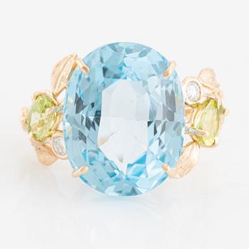 Ring, cocktail ring with blue topaz, peridot, and brilliant-cut diamonds.
