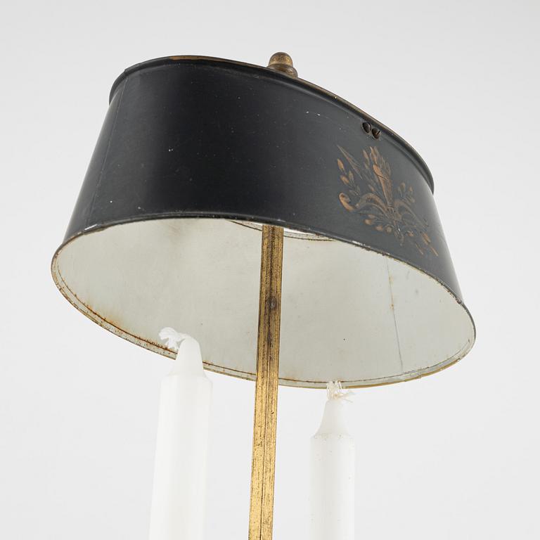 A gilt brass candlestick, 20th Century with older parts.