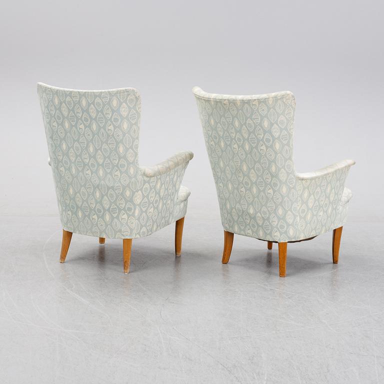 A pair of easy chairs by Carl Malmsten second half of the 20th Century.