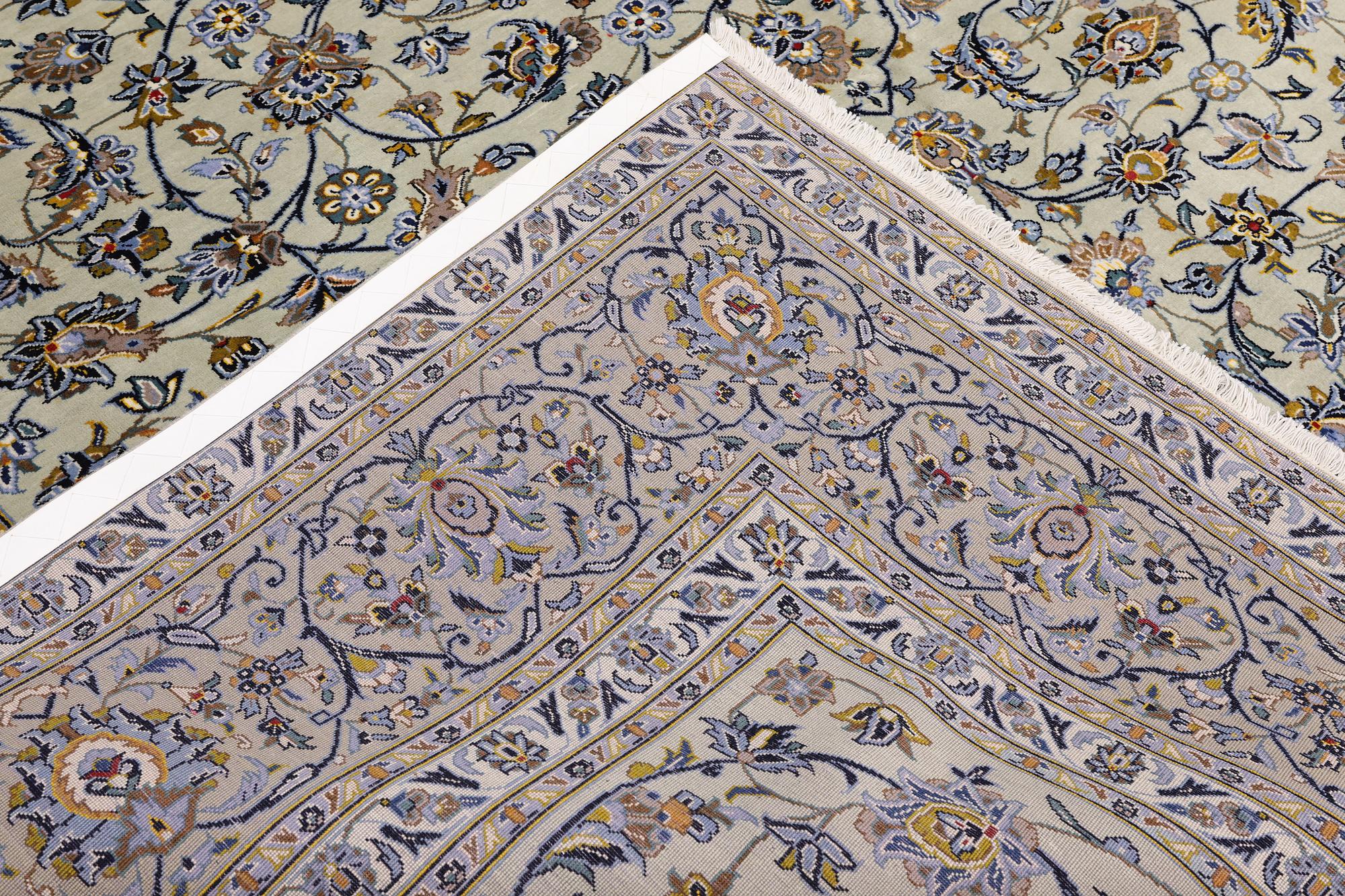 A Keshan carpet, signed, 397 x 302 cm.