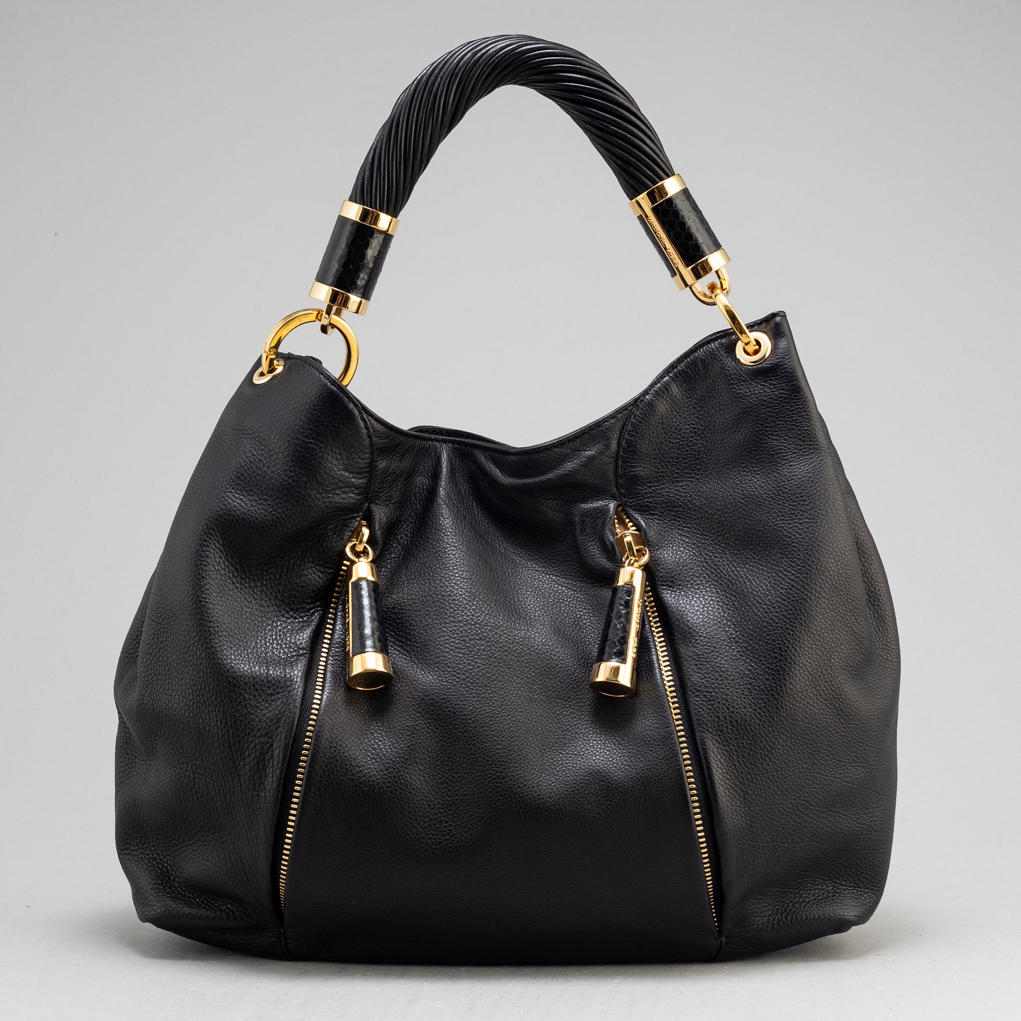 MICHAEL KORS, a black leather handbag.
