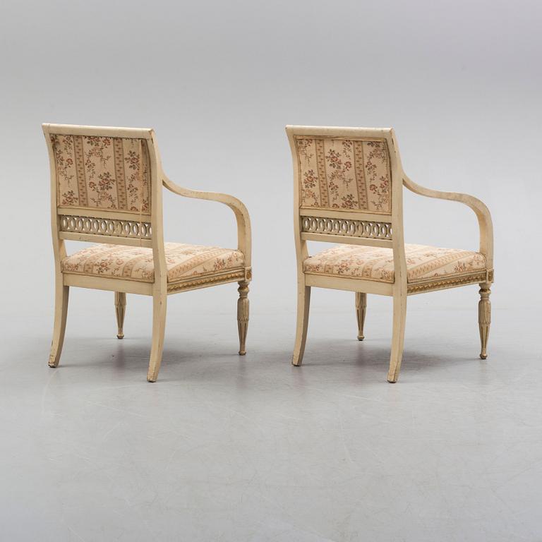 A pair of first half of the 19th century Empire arm chairs.
