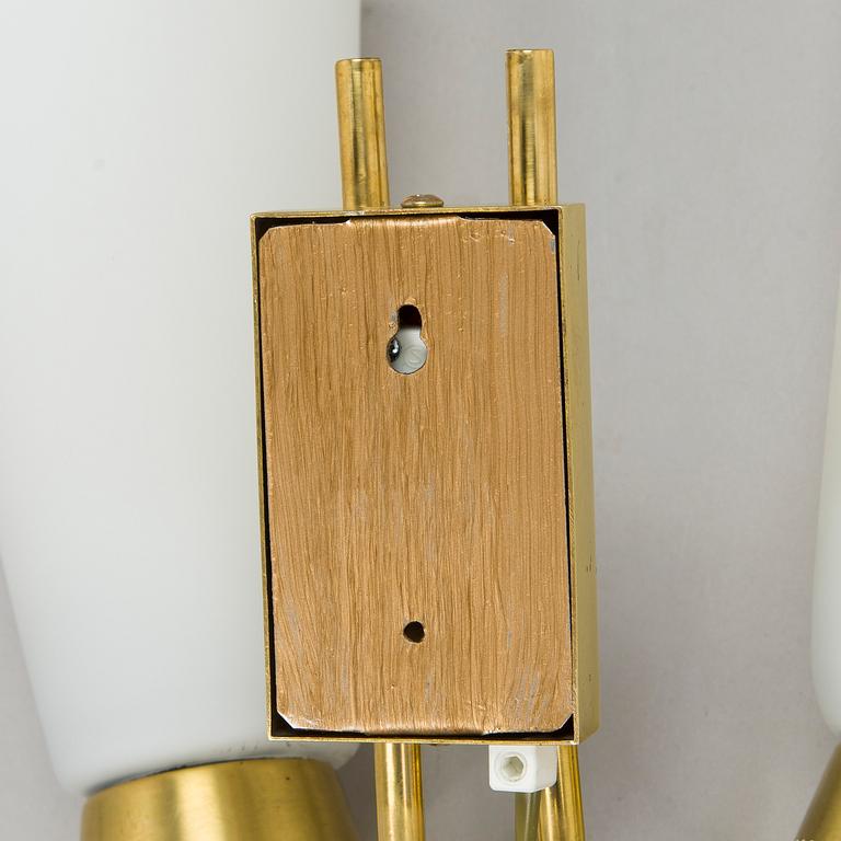 A pair of mid-20th century wall lights, model EY60, Itsu, Finland.