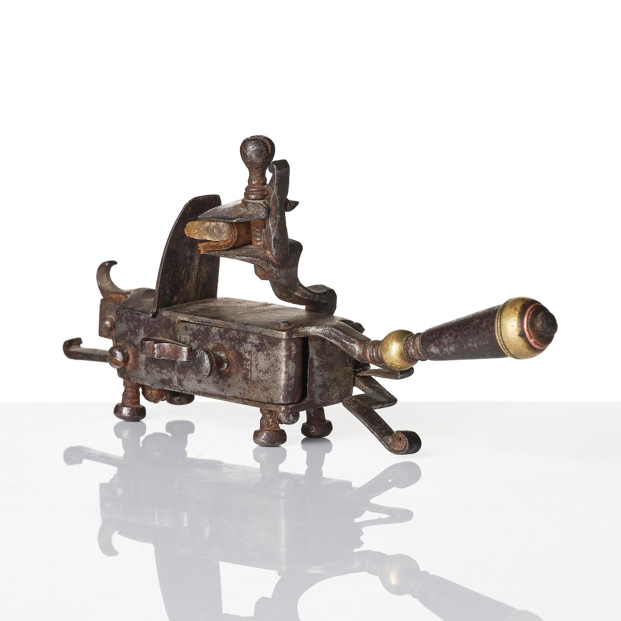 A mechanical flintlock igniter, later part 18th century/early19th century.