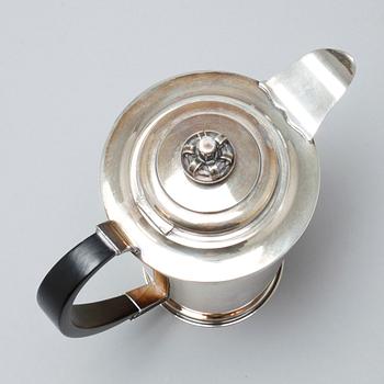 A silver coffee pot, sugar bowl and creamer by Thore Eldh for K&EC in Göteborg, 1949.
