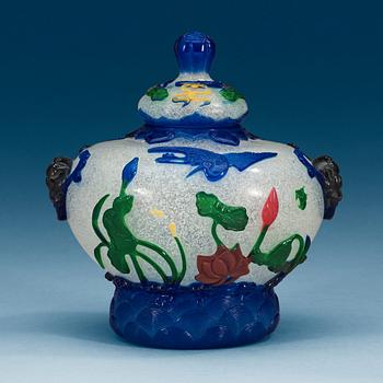 1583. A Chinese Peking glass jar with cover.