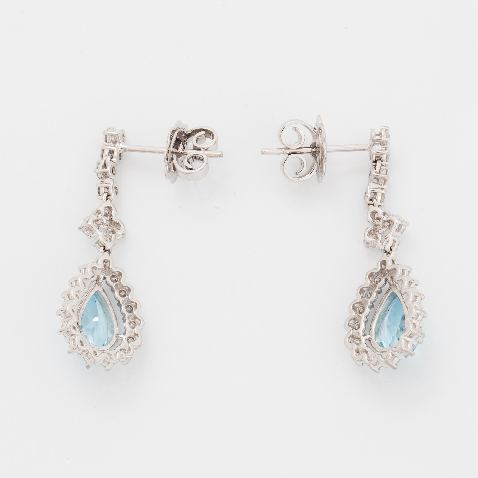 Topaz and brilliant-cut diamond earrings.