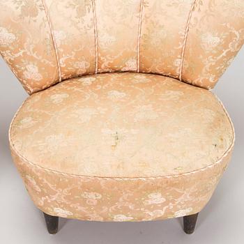 A pair of mid-20th century armchairs.