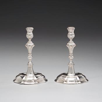 A pair of 18th century silver candlesticks, unidentified makers mark WP.