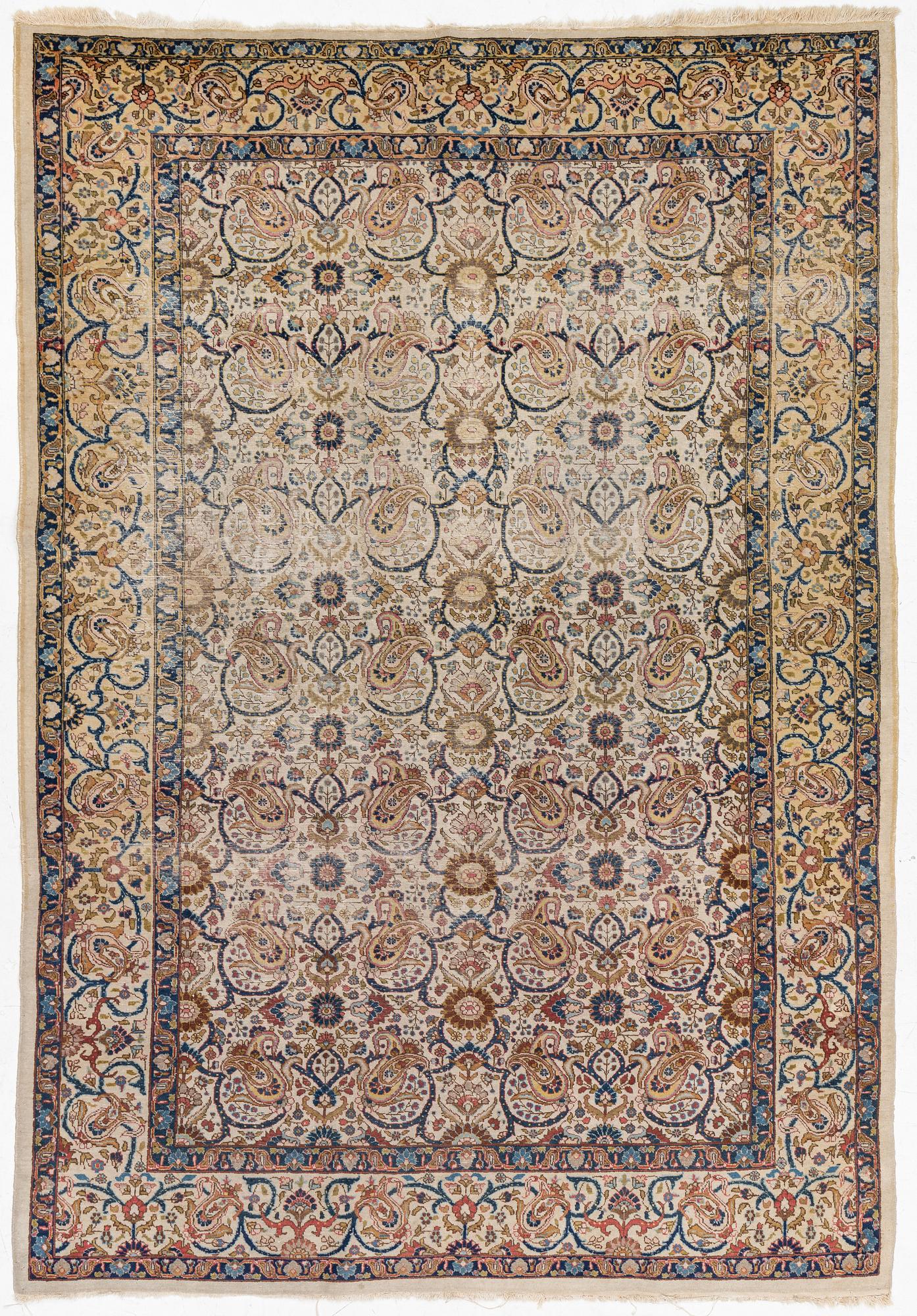 A Tabriz carpet, semi-antique, c. 330 x 230 cm.