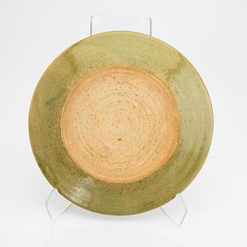 Signe Persson-Melin, a set of nine 1950s kopper glazed stoneware plates.