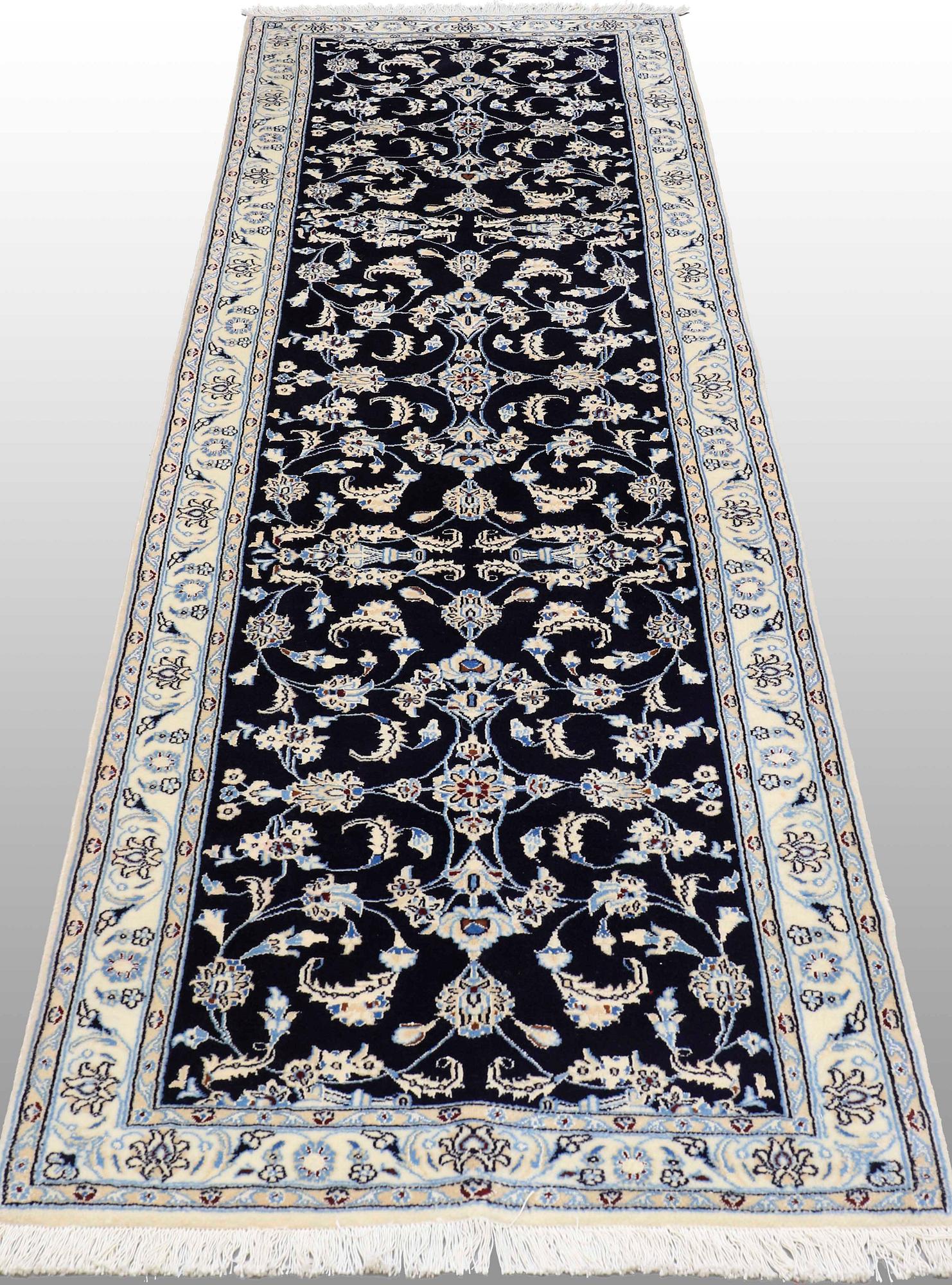 A Nain runner, part silk, approx. 294 x 90 cm.