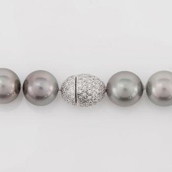 A cultured Tahiti pearl, 12-14.7 mm, and diamond necklace.